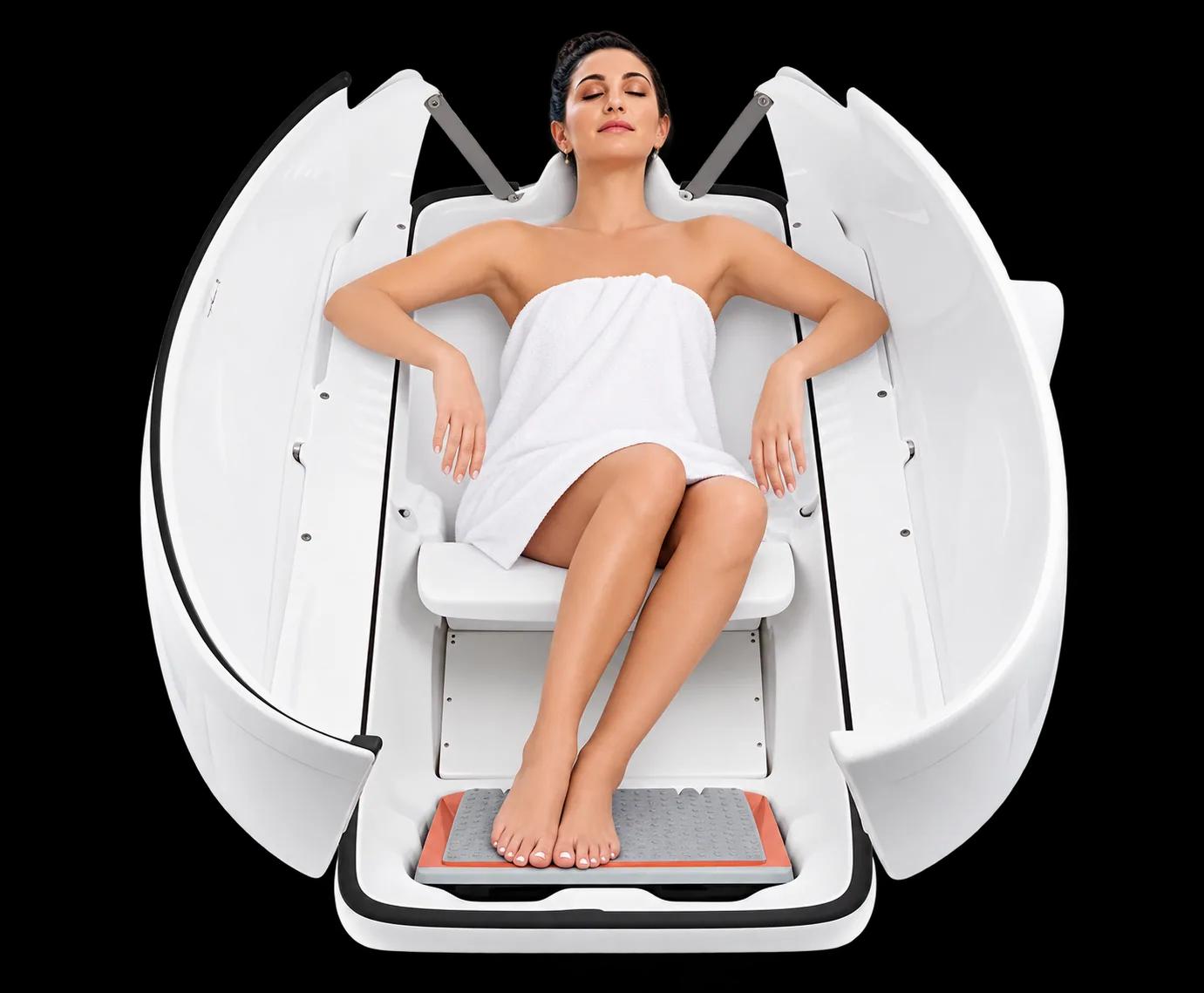 A client seated inside an open ozone sauna pod
